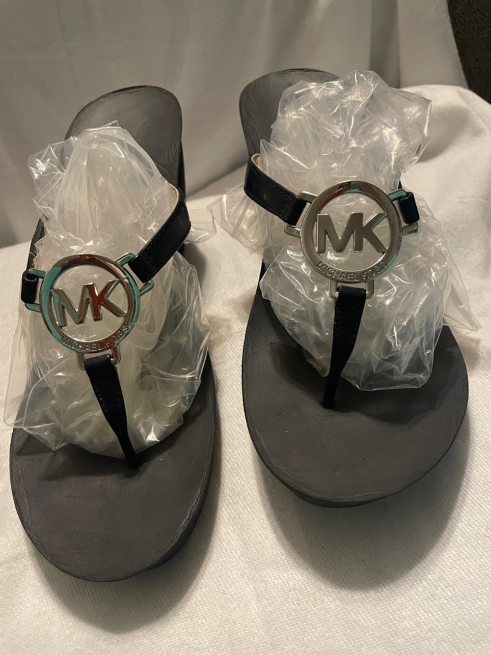 Michael Kors Black Thong Sandals with Silver MK Medallion